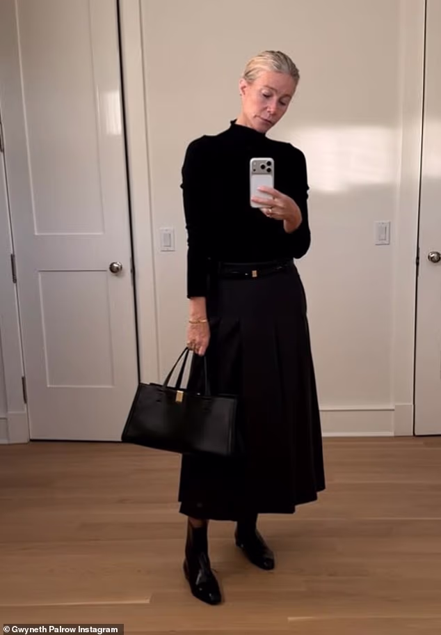 In one snap, the beauty looked effortlessly chic in an all-black ensemble consisting of a knitted roll neck jumper and a pleated midi skirt
